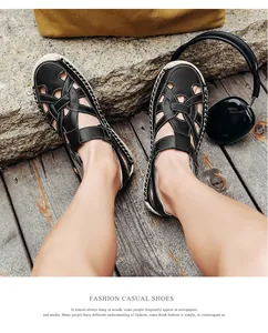 Detail of hand-stitched leather on black woven closed-toe sandals for men