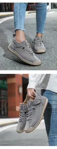 Detail of hand-stitched seams and flexible rubber sole on casual grey leather shoes