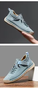 Detail of light blue suede casual shoes with manual stitching and rubber sole texture