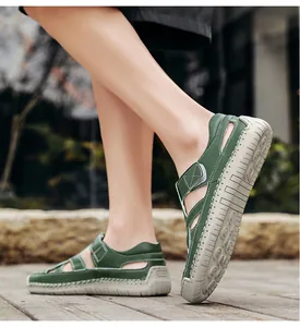 Side view of men's dark green outdoor sandals with contrast stitching and cutout design
