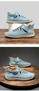 Detail of light blue high-top shoe with white stitching and thick rubber sole