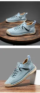Detail of hand-stitched light blue suede loafers with velcro strap and rubber sole