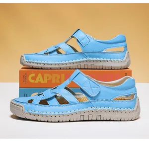 Close-up of hand-stitched light blue woven leather sandals with durable rubber sole