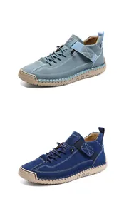 Close-up of suede casual shoes with contrast stitching, quick-lace and velcro strap