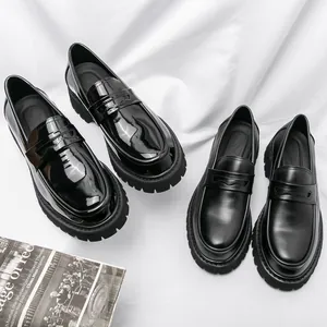 Detailed comparison of glossy patent and matte black leather lug sole loafers