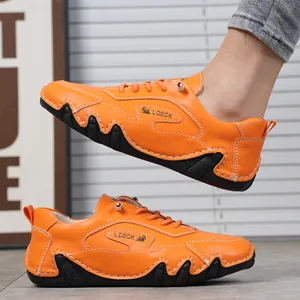 Dettagli di scarpe casual in pelle arancione brillante con cuciture artigianali