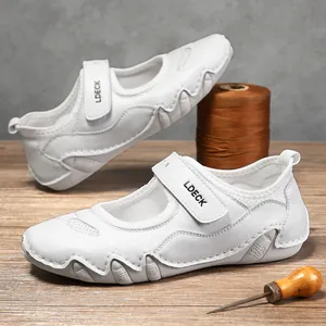 Zapatillas casuales de cuero blanco para mujer con velcro y suela de goma ondulada