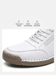 Detail of white leather women shoes with contrast stitching and rubber sole side engraving