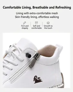Detail view of white leather high-top sneakers with metal zipper and soft mesh lining