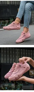 Detailed view of pink breathable mesh sneakers for women with suede fabric and rubber sole
