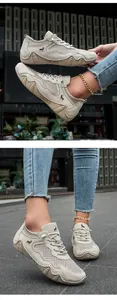 Detailed close-up of breathable mesh fabric and wavy rubber sole on casual beige sneakers