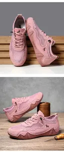 Detail of pink mesh outdoor sneakers with elastic drawstring laces and suede panels