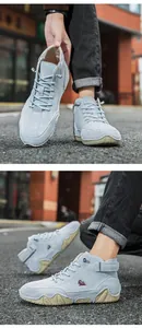 Detail of high-top casual boot featuring soft blue suede and wavy rubber sole texture