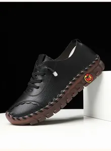 Detail of hand-stitched litchi texture leather upper and non-slip rubber sole