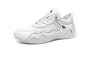 Detail of white mesh sneaker showing synthetic leather overlays and ram logo on the side