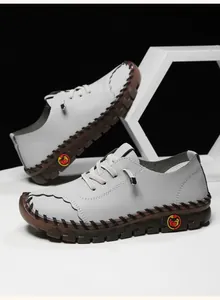 Detail showing the gray pebbled leather texture and thick rubber sole of the casual men shoe