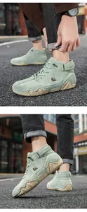 Detail of mint green suede high-top boots featuring brown logo and wave rubber sole