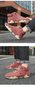 Macro shot of burgundy suede boots showing embossed logo and white wavy sole detail