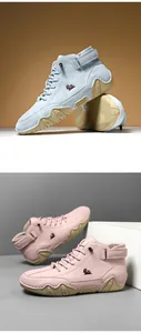Detail showing blue suede and pink textured leather high-top boots with wavy rubber soles