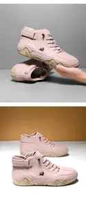 Pink mid-top leather boot featuring a sheep logo, lace-up closure and velcro ankle strap