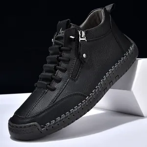 Men's black pebbled leather ankle boots with side zipper and handmade stitching detail