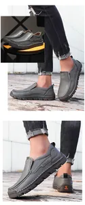 Details grauer Leder-Loafer mit handgenähten Nähten und perforierten Seitentexturen