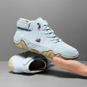 High-top light blue leather outdoor shoes with rubber octopus sole and velcro strap