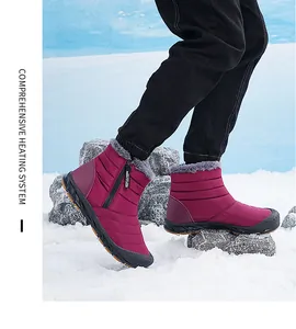 Close-up of waterproof burgundy snow boot with thick faux fur lining and side zipper