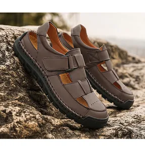 Detail of dark brown leather sandals with adjustable velcro strap and rubber sole