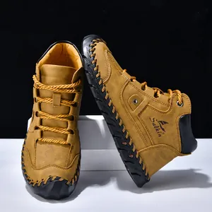 Detail showing contrast stitching and thick rubber anti-slip sole on men's leather boots