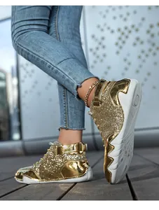 Sneaker alte in glitter dorati con motivo unico della suola a polipo