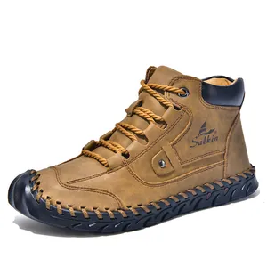 Detailed view of handmade stitching on men's leather high-top boots with Salkin logo