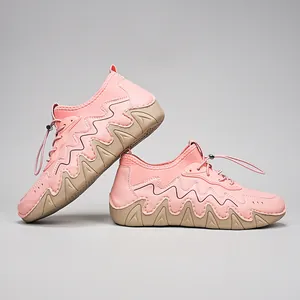 Detail of pink outdoor shoes with thick khaki soles and elastic drawstring closure