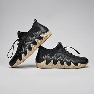 Detail of outdoor sneakers featuring wave-shaped thick rubber soles and drawstring closure