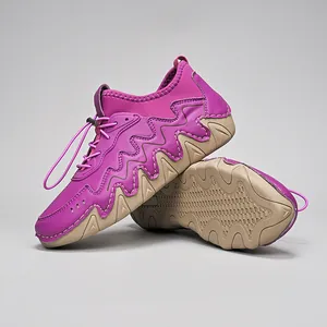 Detail of purple outdoor casual shoes with wave stitching and toggle lacing system