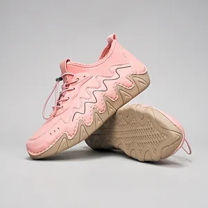 Pink outdoor leisure shoes with khaki non-slip rubber soles and quick-lace drawstring closure