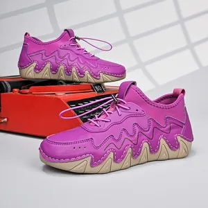 Detail view of purple outdoor sneakers with wavy rubber sole on a vintage typewriter