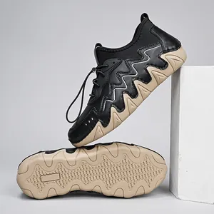 Detail of outdoor shoes featuring thick wavy rubber soles and toggle lacing system