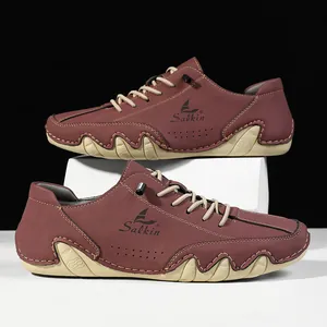 Detail of burgundy leather casual shoe with Salkin logo and unique wavy sole design