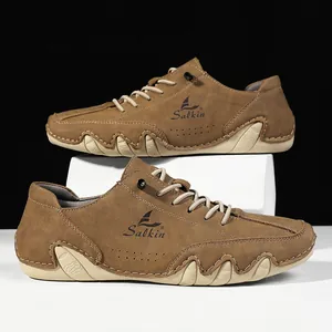 Detail of brown leather casual shoe showing Salkin logo and unique wave sole design