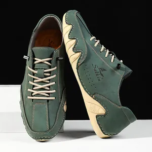 Detail of dark green suede casual shoes with beige rubber soles and Salkin branding