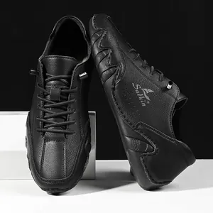 Close-up of black leather casual shoes featuring textured grain and durable rubber soles