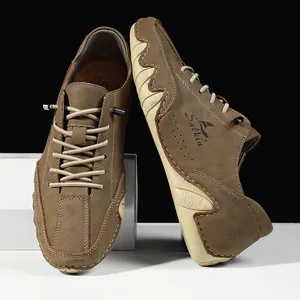 Detail of tan suede casual men's shoe with wavy rubber sole and Salkin logo