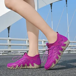 Outdoor view of purple casual walking shoes featuring a thick wave-serrated outsole