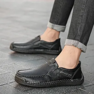 Men's black leather loafers with handmade stitching and non-slip rubber soles for driving