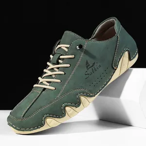 Dark green suede men casual shoes with beige laces and artisanal white stitching