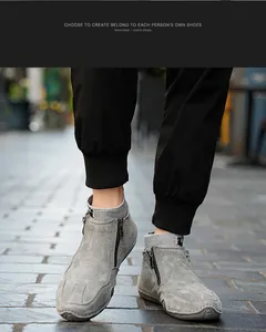 Details graue Wildleder-Stiefeletten mit Metallreißverschluss und Strickbündchen