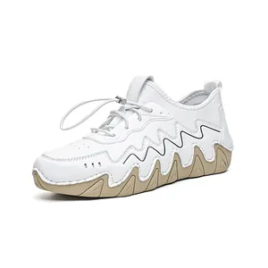 Men's stylish white synthetic leather sneakers with wavy rubber soles and elastic laces