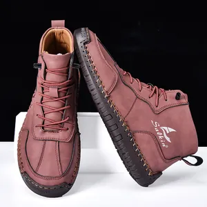 Détail de bottines en cuir marron rouge avec logo Salkin et semelle en caoutchouc