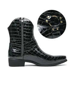 Detail view of black embossed faux crocodile leather boots with metal zipper and ring buckle